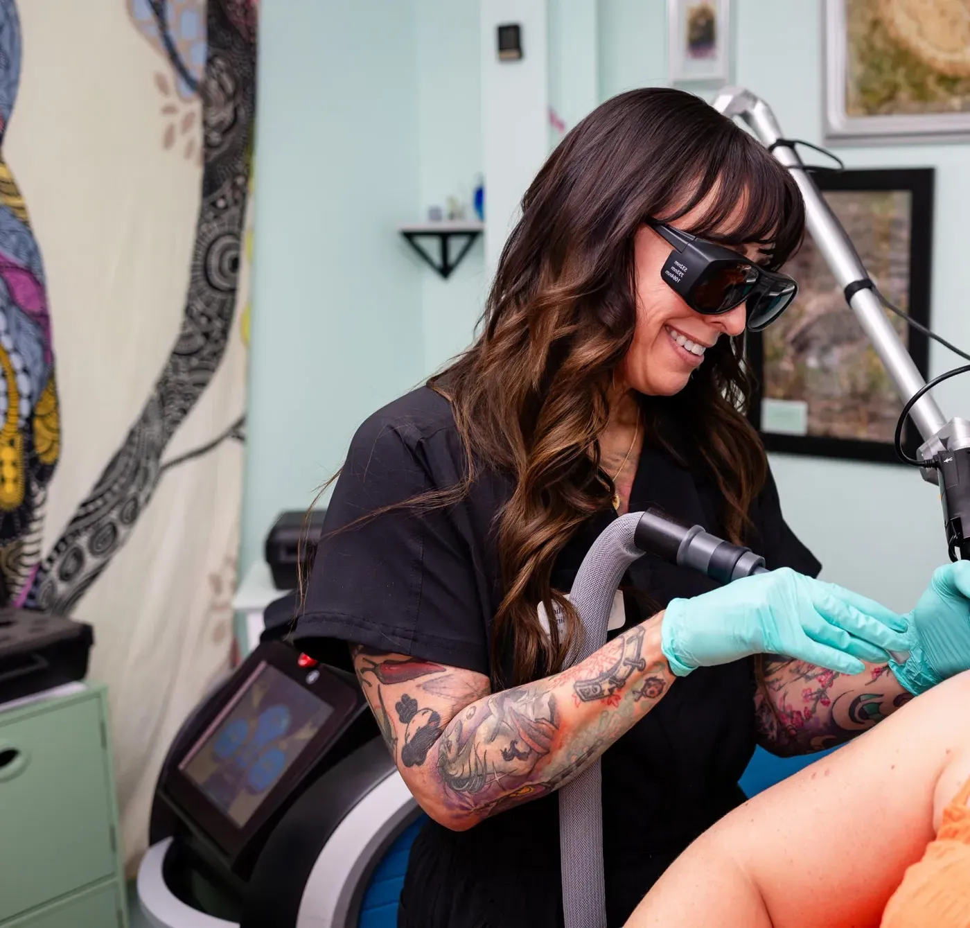 Christie performing a laser treatment at Wise Choice Laser Clinic